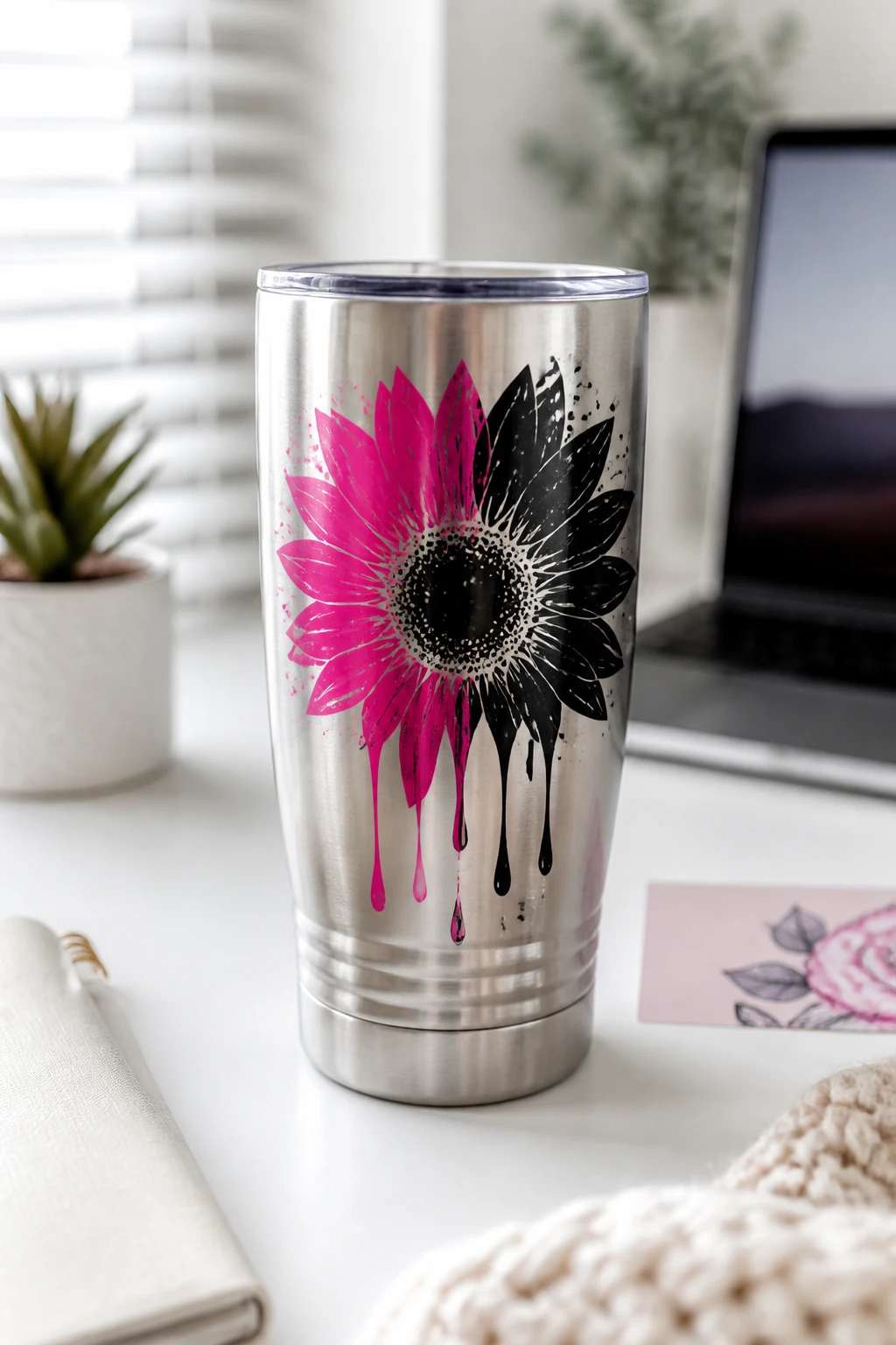 A high-quality lifestyle shot of a customized stainless steel tumbler on a clean, modern desk setup with soft natural light, featuring a personalized vinyl design in a bold color palette, a subtle care card partially visible in the background, and a neutral blurred workspace to emphasize the tumbler as the focal point. No text on the image.